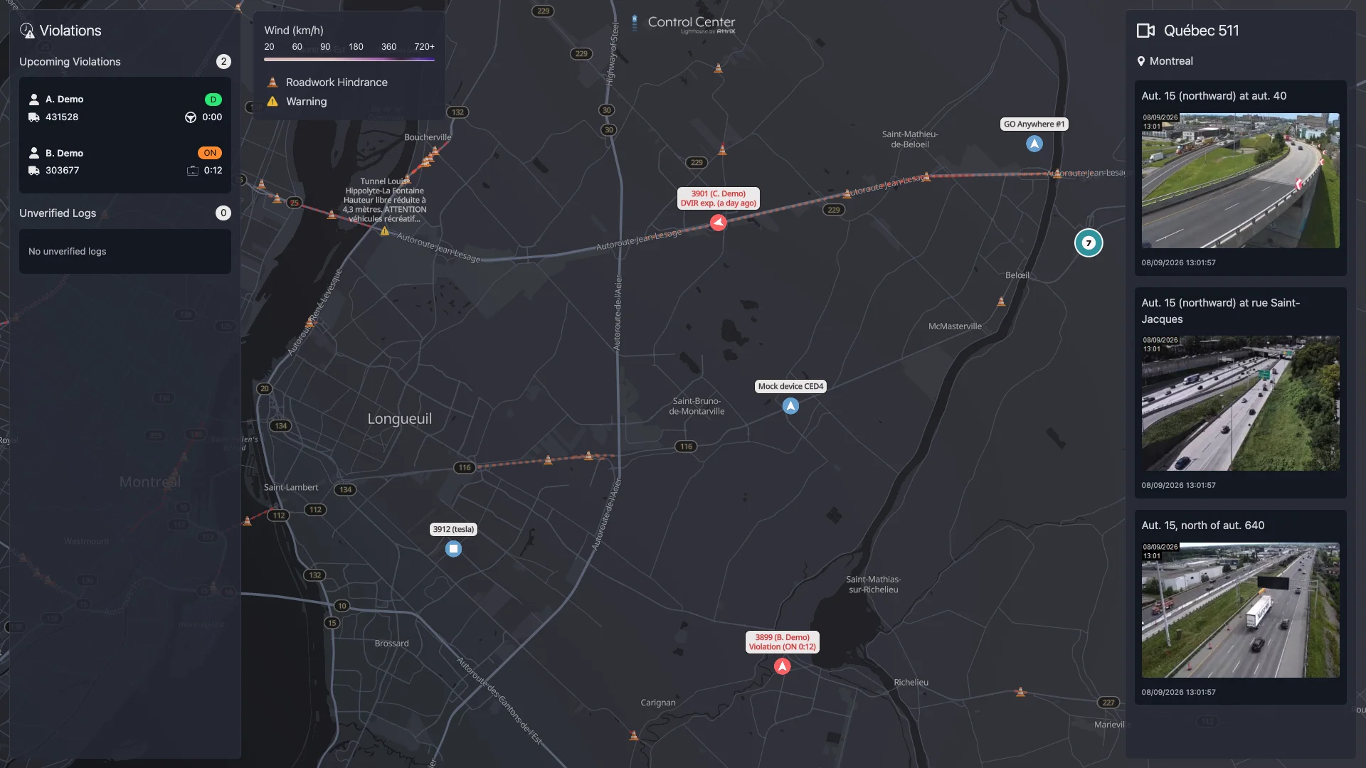 Control Center on a wall screen: upcoming hours-of-service violations, a live map with violation and expired-inspection alerts, roadwork and road warnings, and 511 traffic cameras